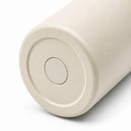 Base of the OWAW Nomade 32 oz sports water bottle in Cream White, textured powder-coated finish